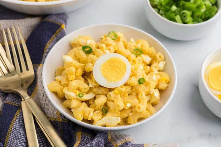 Creamy deviled egg pasta salad in a large serving bowl.