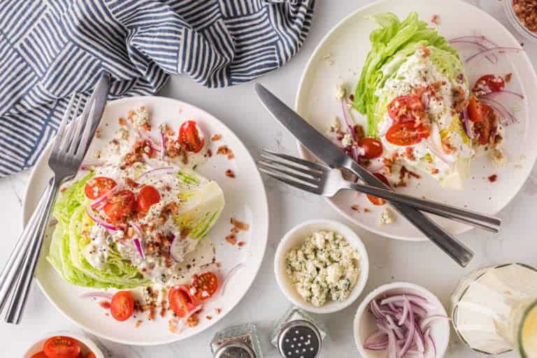 Classic wedge salad topped with bacon blue cheese and ranch dressing.