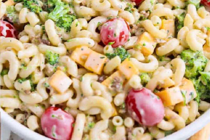 Creamy bacon ranch pasta salad in a white serving bowl.