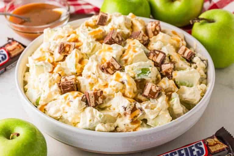 Snickers Salad served in a white bowl.