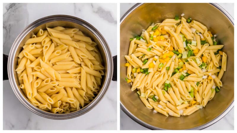 cooked noodles in metal bowl withe veggies.