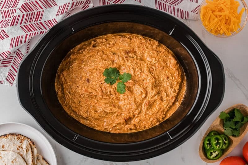top-down view of the Queso Chicken in the slow cooker.