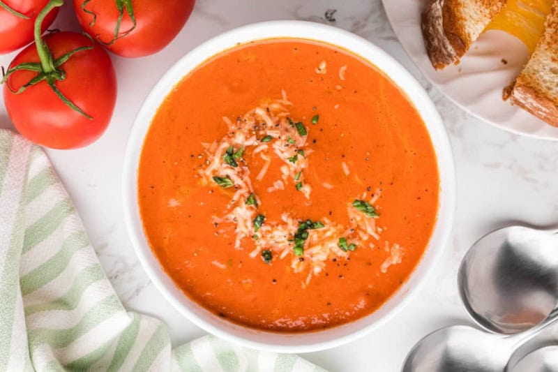 top-down view of the Slow Cooker Tomato Soup served in a white bowl.