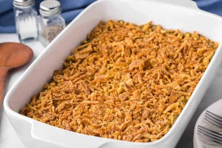 Green Bean Casserole baked in a white baking dish.