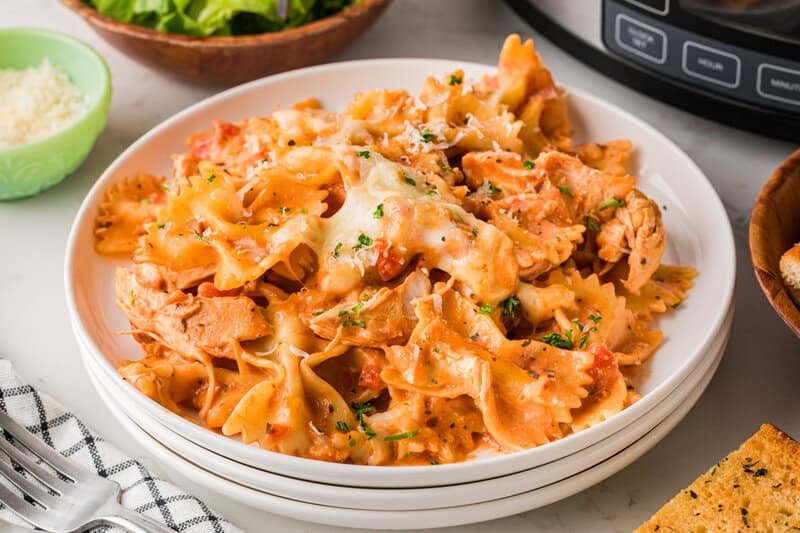 Creamy Chicken Pasta served on white plates.
