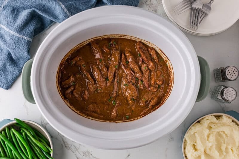 top-down view of the slow cooker steak and gravy.