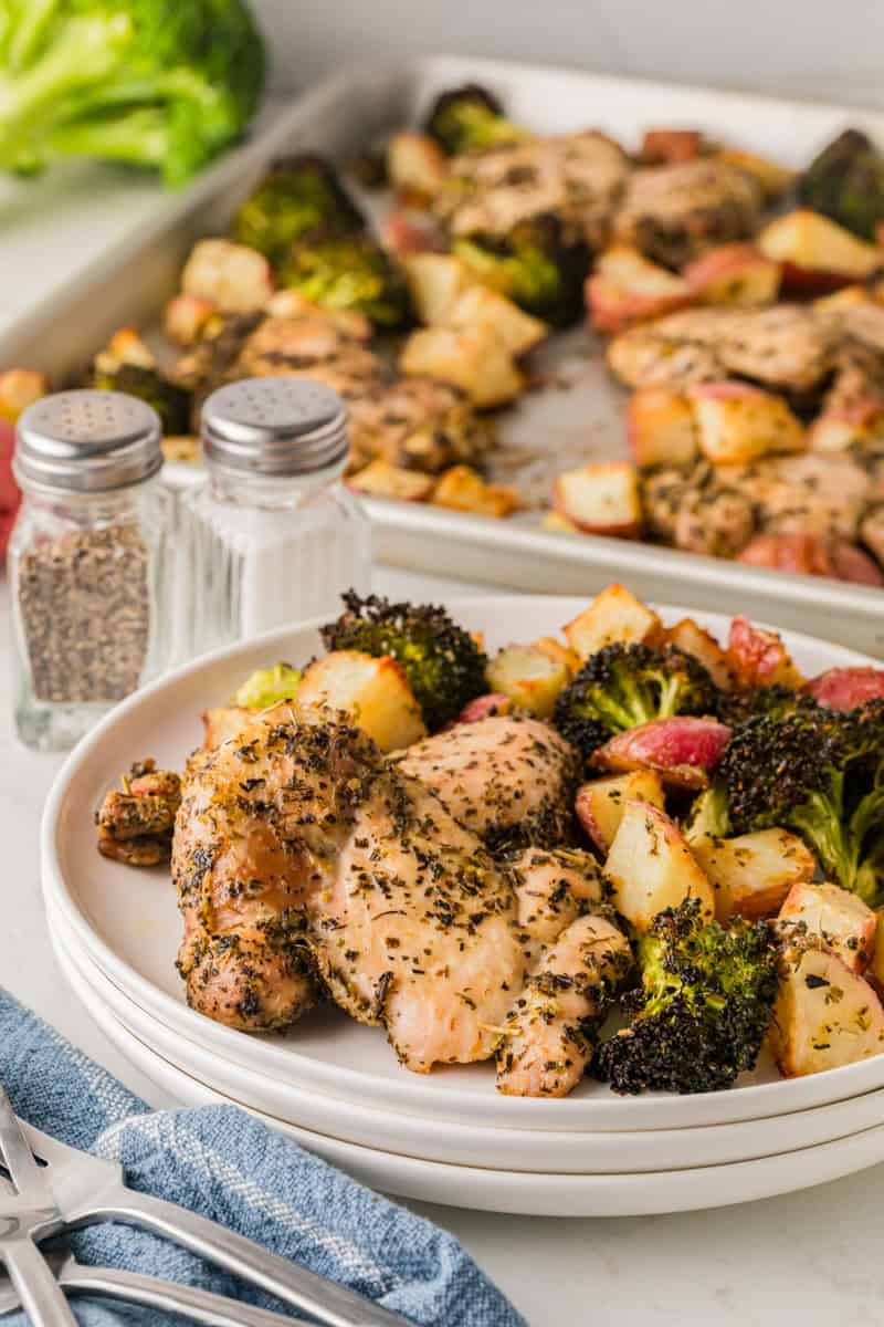 Sheet Pan Chicken and Vegetables served on white plates.