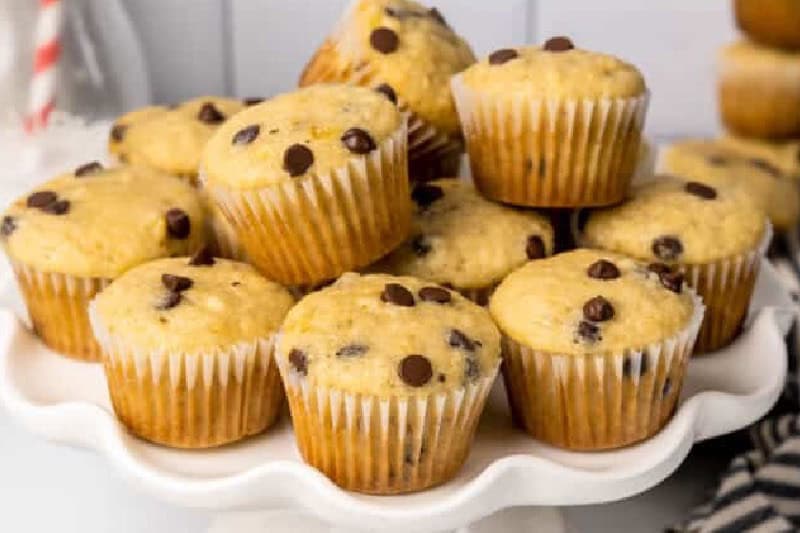 stack of the Mini Banana Chocolate Chip Muffins served on a white tray.