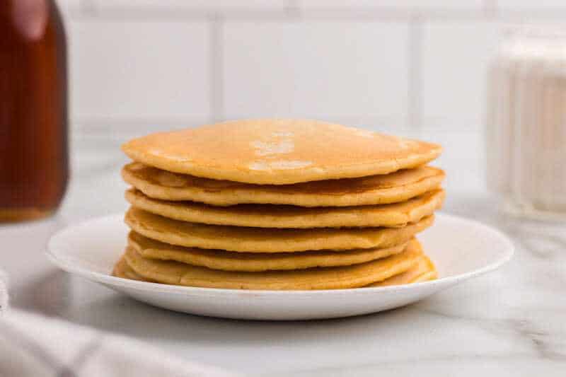 stack of homemade Pancakes on a white plate.