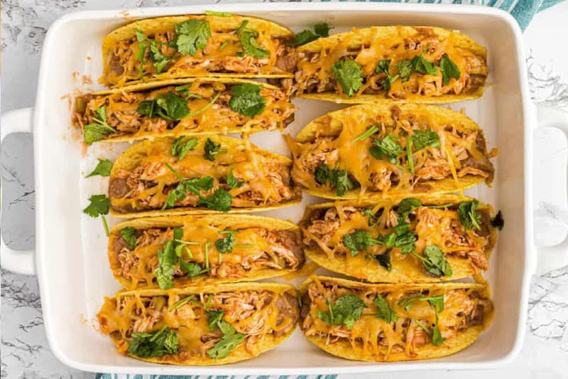 top-down view of the Baked Chicken Tacos in a white baking dish.