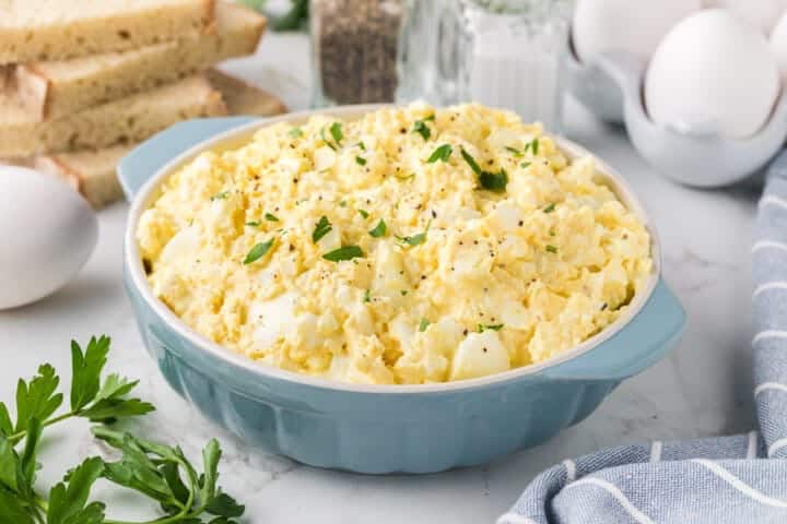 Classic Egg salad served in a large blue bowl.