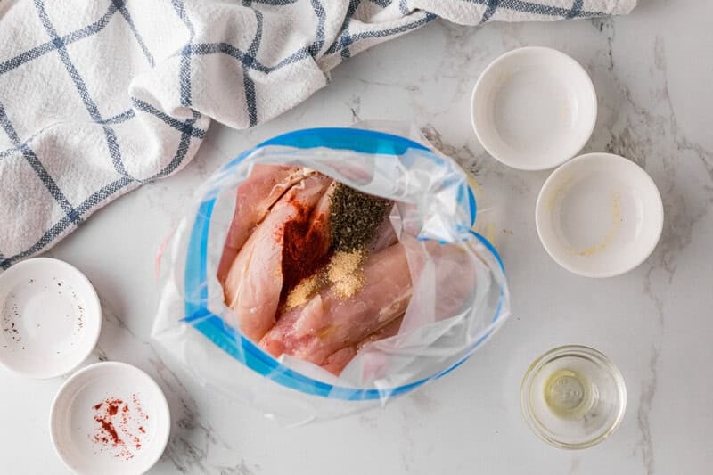 tenderloins in a Ziplock bag with seasoning and oil.