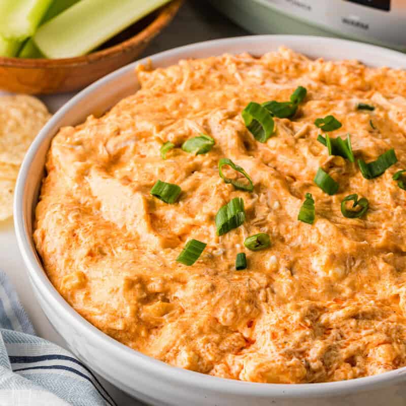 closeup of the Slow Cooker Buffalo Chicken Dip served in a large white bowl.