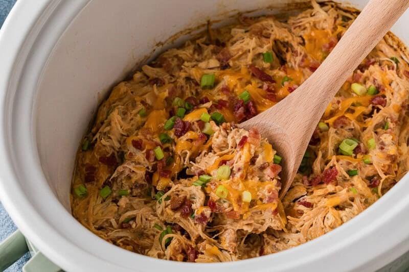 closeup of the Crack Chicken being served out of the slow cooker.