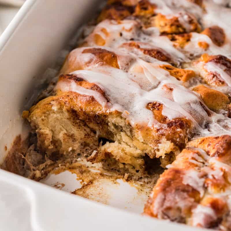 closeup of the Cinnamon Roll Casserole with a slice taken out of it.