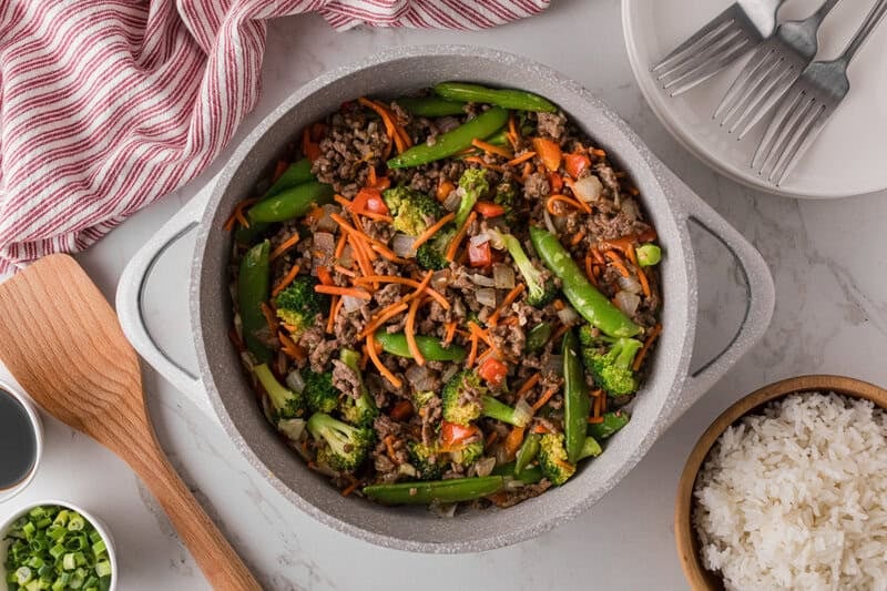 top-down view of the ground beef stir fry in a large pot.