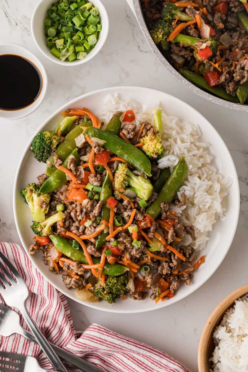 top-down view of the ground beef stir fry served with white rice.
