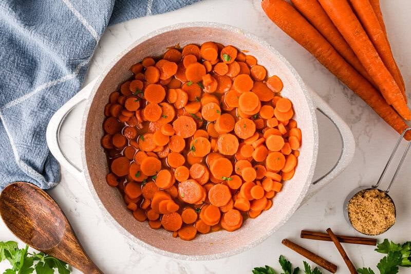 top-down view of the carrots cooking in a pan.
