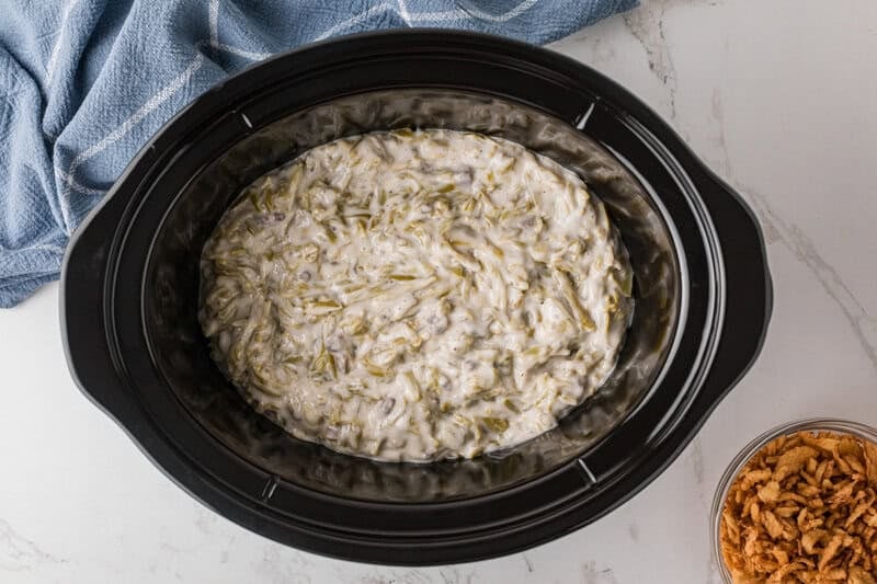 top-down view of the Green Bean Casserole in the slow cooker.