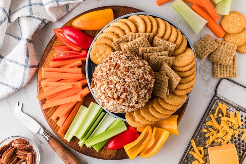 top-down view of the Cheese Ball with crackers and veggies for dipping.