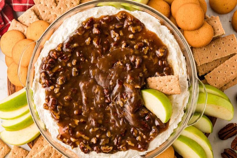 Pecan Pie Dip with a graham cracker and apple slice in it.