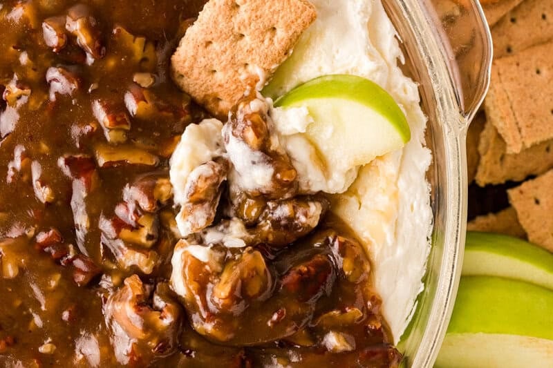 closeup of the Pecan Pie Dip with an apple slice dipped into it.